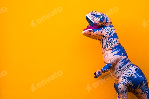Preview: one big and tall dinosaur enjoying and having fun with orange background