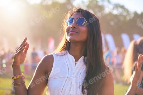 Preview: Happy African woman dancing at festival