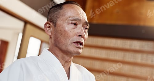 Preview: Aikido, master and man in martial arts, class or sensei talking in traditional gym of Japanese tech