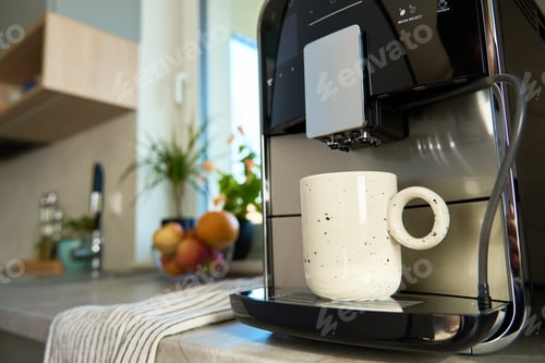 Preview: Coffee machine with cup of coffee in kitchen