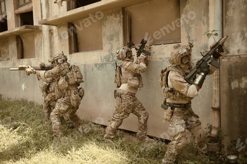 Preview: Professional marine soldiers training with weapon on a military range.