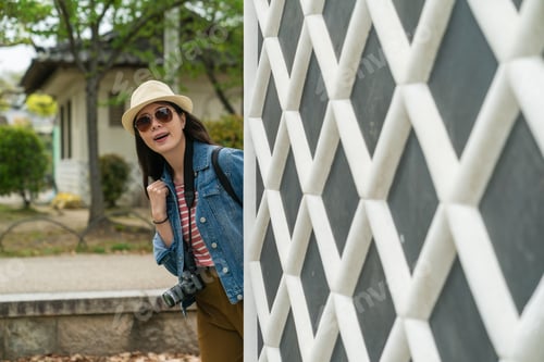 Preview: girl popping head behind wall of osaka castle