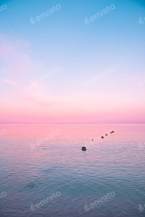 Preview: Row of floating buoys on the coast of Okinawa, Japan during sunset