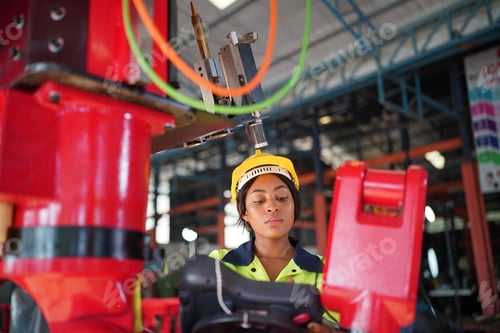 Preview: Robotics engineer working on maintenance of robotic arm in factory warehouse. Business technology.