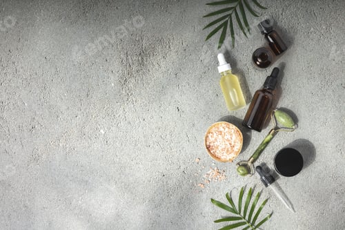 Preview: Natural SPA cosmetic products background, Composition with bottles of essential oils, sea salt and m