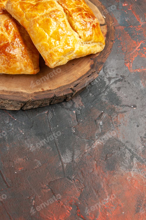 Preview: bottom view penovani khachapuri on wood board on dark red background with copy place
