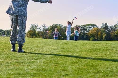 Preview: Happy usa family is meeting their father in military camouflage.