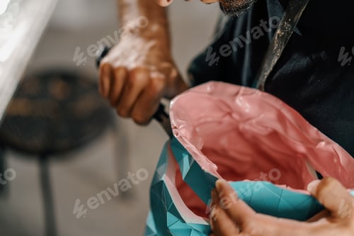 Preview: Artisan sculptor artist creates a work of art in his workshop