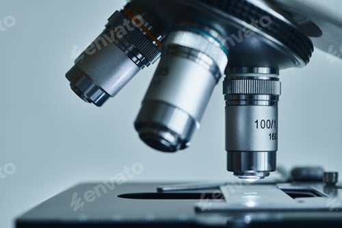 Preview: Modern microscope with metal lens at laboratory.