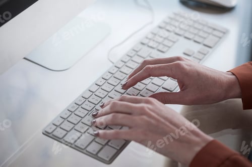 Preview: Close-up of woman working on computer