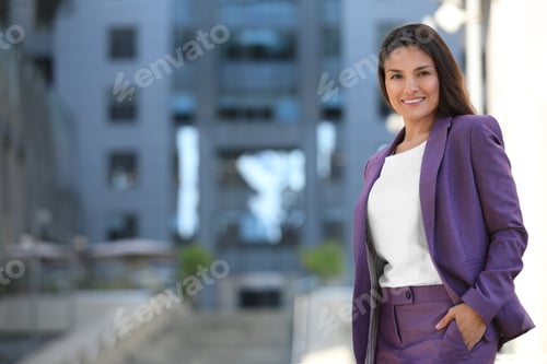 Preview: Beautiful confident businesswoman on city street. Space for text