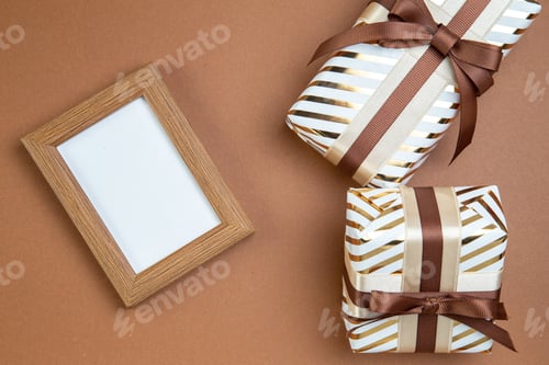 Preview: top view little presents on brown background color marriage couple affection passion gift feelings