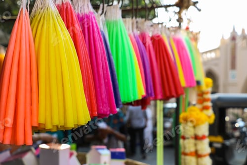 Preview: Colourful candles on a display at a shop outside church