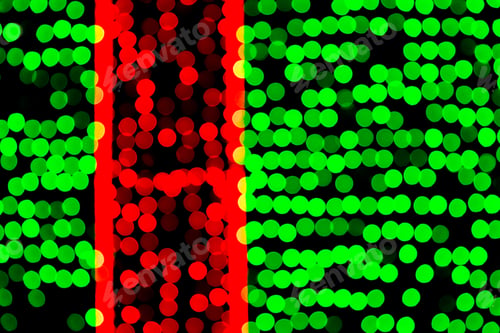 Preview: Unfocused abstract green and red bokeh on black background. defocused and blurred many round light