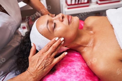 Preview: Pleased brunette woman being on beauty procedure