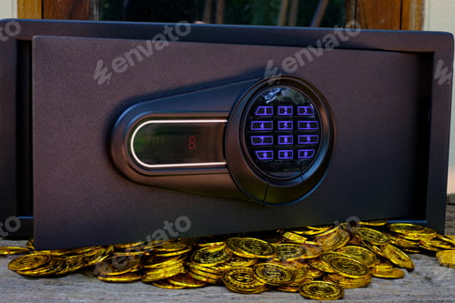 Preview: Steel safes box full of coins stack and gold bar on the wooden table