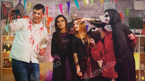 Preview: Group of friends in costumes taking a selfie