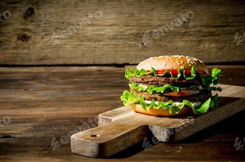 Preview: One Burger with beef,salad and vegetables.