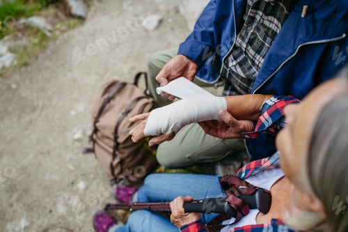Preview: Senior woman injured her arm during hike in the mountains.
