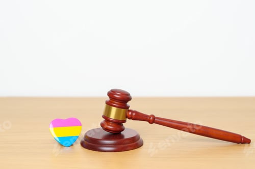 Preview: gavel justice hammer with pink, yellow and blue heart shape for Lesbian, Gay, Bisexual, Transgender