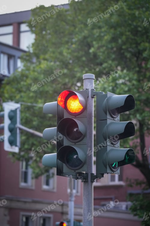 Preview: Traffic light on the corner of a street with the red light on