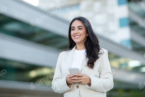 Preview: Woman Using Smartphone in Urban Setting During Daytime