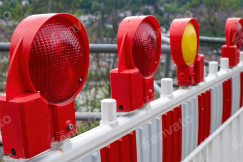 Preview: Construction safety. Street barricade with warning signal lamps on a road