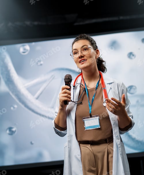Preview: woman is giving a presentation at a conference