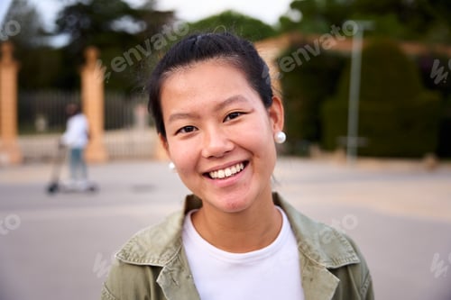 Preview: Close up portrait of happy beautiful young Asian woman happy smiling face on street. Female people.
