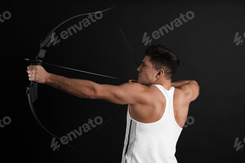 Preview: Man with bow and arrow practicing archery on black background