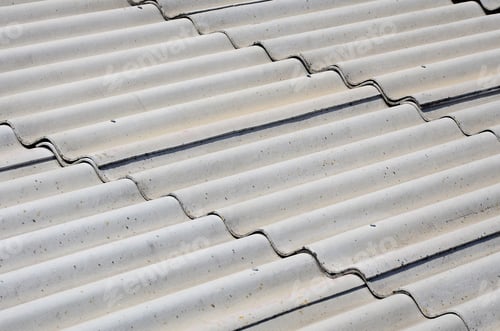 Preview: A fragment of a gray slate roof of an old sample made of asbestos material