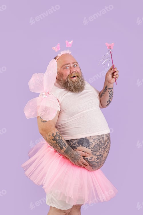 Preview: Happy plus size male person in fairy costume poses on purple background