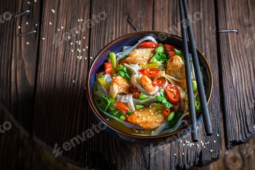 Preview: Spicy noodle with chicken, vegetables and chili peppers