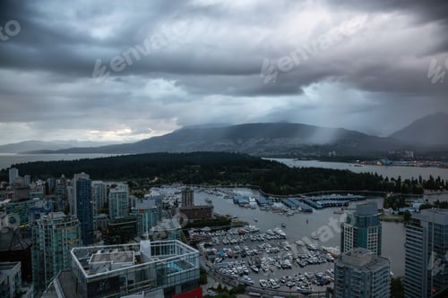 Preview: Aerial view of Downtown City during a stormy summer evening before sunset