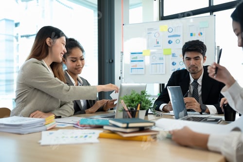 Preview: diverse business team people and female leader boss discuss financial result review paperwork share