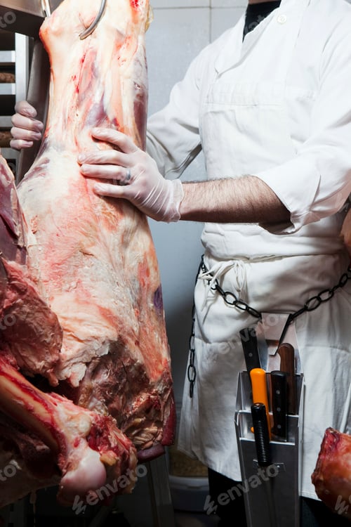 Preview: Butcher hanging beef