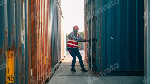 Preview: Worker container shipping logistics safety worker opening cargo container shipping yard during