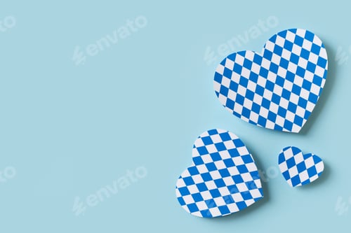 Preview: Oktoberfest paper cut heart design on blue background