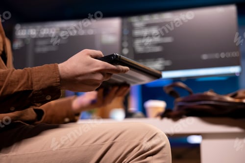 Preview: Software developer opening laptop to write programs in Java programming language