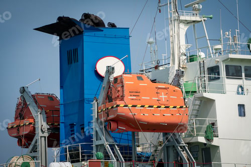 Preview: lifeboat on cargo container ship. Safety lifeboat is one of the most important life-saving