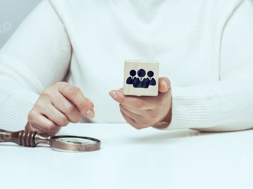 Preview: Recruitment, identification of talented employees. Woman holding wooden cube with staff icon