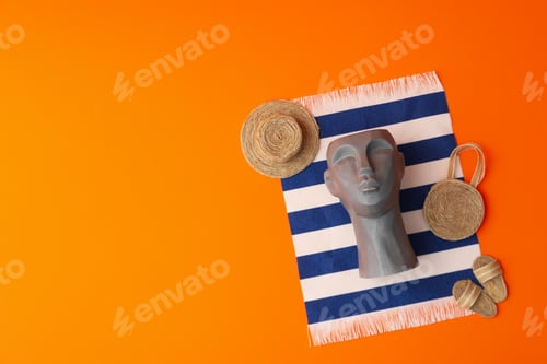 Preview: Vacation concept with decorative head on orange background