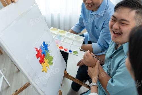 Preview: Asian happy family draw picture with young son in living room at home.