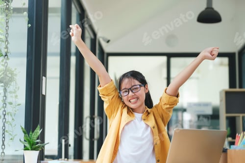 Preview: Enjoy young woman celebrate success or happy pose.