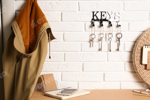 Preview: Metal key holder on white brick wall indoors