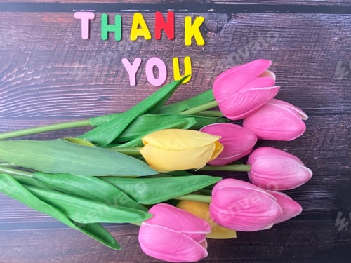 Preview: Nice bouquet of tulip flowers on wooden background