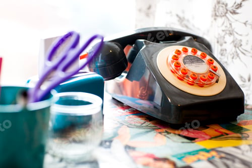 Preview: Old fashioned telephone on the reception desk of quirky hair salon