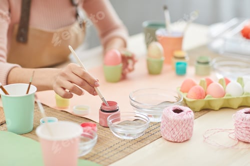 Preview: Young Woman Hand-Painting Easter Eggs Closeup