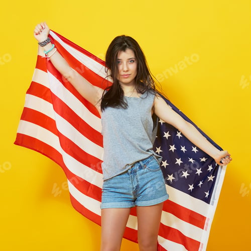 Preview: Cheerful teenage patriotic girl with US flag