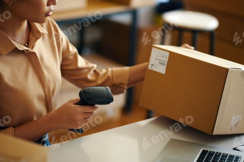 Preview: Worker Scanning The Parcel Before Shipping